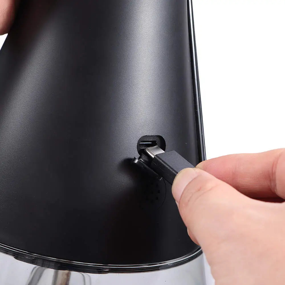 Charging the Smart Shisha: Hand inserting charger into the shisha's charging port.